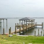 Custom Boat Dock with Boat Lift and Roof