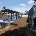 Custom Boat House with boat lift and shingle roof