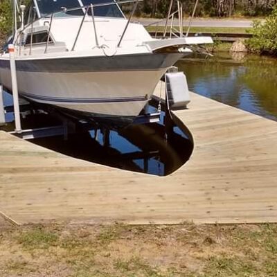Custom cut out dock for special boat lift with no roof. Side mount boat lift