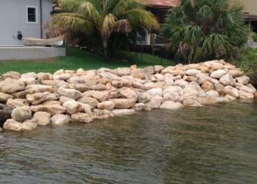 After coquina seawall installation a view from the river toward the house