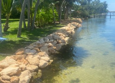 Coquina Seawall Installation showing very clear water in the River